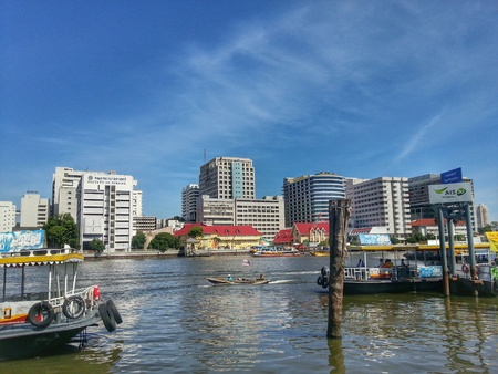 Bangkok, Thailand - July 6, 2014 : Ferry boats is crossing between Bangkok and Thonburi in Chao Phraya River.のeditorial素材