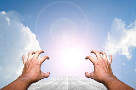 Hand on Wood way and Blue sky backgroundの写真素材
