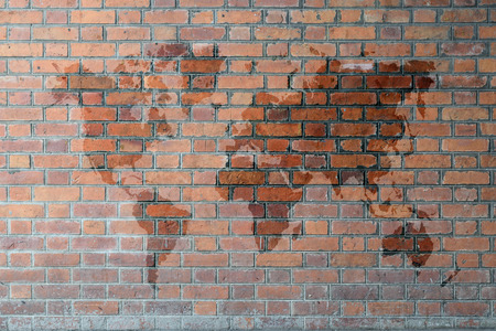 Red Brick wall texture background with world mapの写真素材