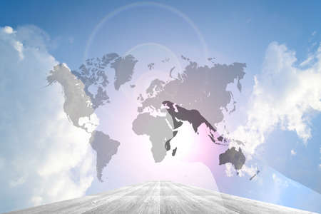 Hand on Wood way and Blue sky background with world mapの写真素材