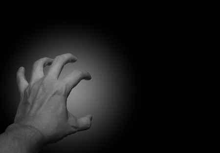 Human open empty hands with black backgroundの写真素材
