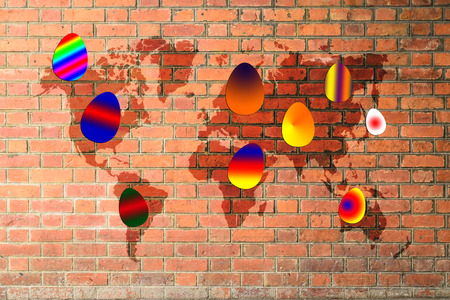 Colorful easter eggs on red brick wall texture background with world mapの写真素材