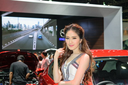 Nonthaburi, Thailand - March 29, 2015 : Pretty girl in the 36th Bangkok International Motor Show 2015 at the Challenger hall, IMPACT Muang Thong Thani.のeditorial素材