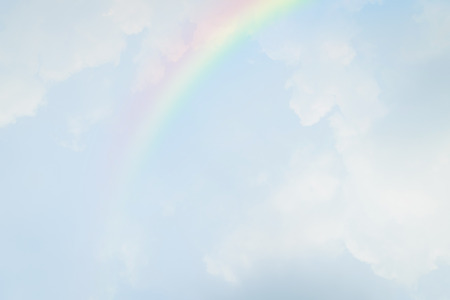 Blue sky and white cloud with rainbowの写真素材