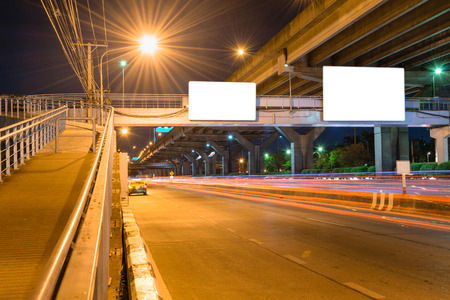 Night road long exposure with blank billboard for advertisement in Bangkok Thailandの写真素材
