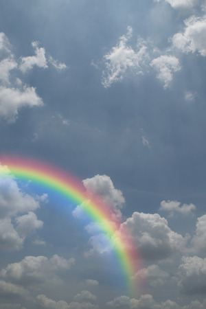 Nature cloudscape with blue sky and white cloud with rainbowの写真素材