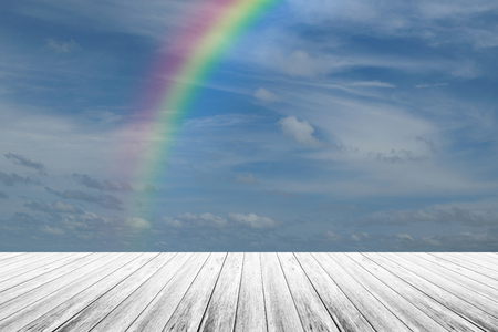 Wood terrace and Blue sky and white cloud with rainbowの写真素材
