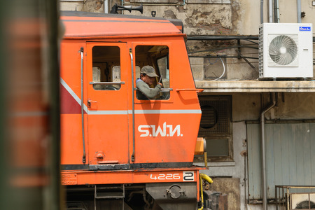 Bangkok, Thailand - September 12, 2015 : Unidentified railway employees driveing the locomotive for switching the railway before serving at State Railway of Thailand.のeditorial素材