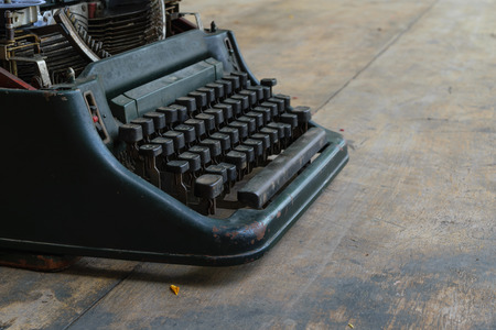 Vintage typewriter on a wood tableの写真素材