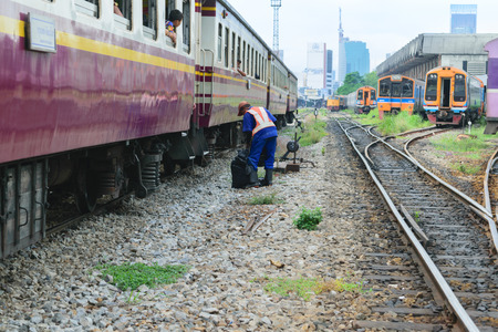 Bangkok, Thailand - September 13, 2015 : Unidentified railway employees working for restoration the railroad tracks before serving at State Railway of Thailand.のeditorial素材