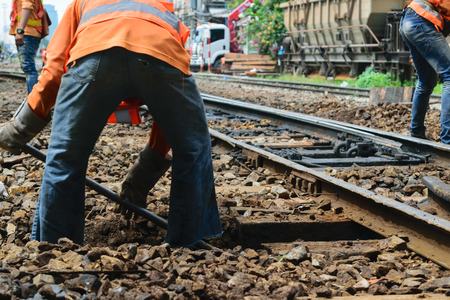 Bangkok, Thailand - September 5, 2015 : Unidentified railway employees working for restoration the railroad tracks before serving at State Railway of Thailand.のeditorial素材