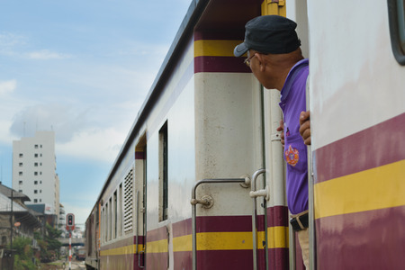 Bangkok, Thailand - September 5, 2015 : Unidentified railway employees controlling the locomotive for switching the railway before serving at State Railway of Thailand.のeditorial素材