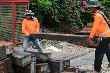 Bangkok, Thailand - September 5, 2015 : Unidentified railway employees working for restoration the railroad tracks before serving at State Railway of Thailand.のeditorial素材
