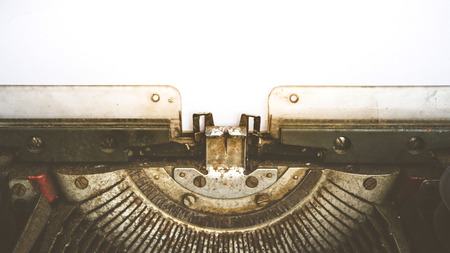 Vintage typewriter and a empty white paper , process in vintage style