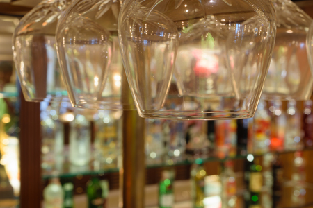 Whiskey glass defocus on Bottles of whiskey at the bar backgroundの写真素材