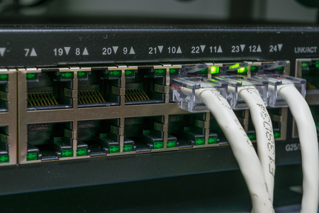 Network switch HUB and ethernet cables (LAN)  in datacenter