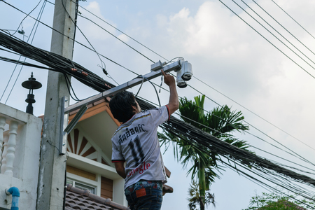 Bangkok, Thailand - October 17, 2015 : Unidentified worker working to install CCTV system in village at Bangkok Thailand.のeditorial素材