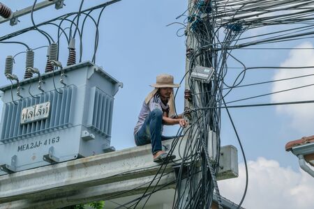 Bangkok, Thailand - October 17, 2015 : Unidentified worker working to install CCTV system in village at Bangkok Thailand.のeditorial素材
