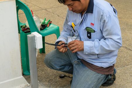 Bangkok, Thailand - October 17, 2015 : Unidentified worker working to install CCTV system in village at Bangkok Thailand.のeditorial素材