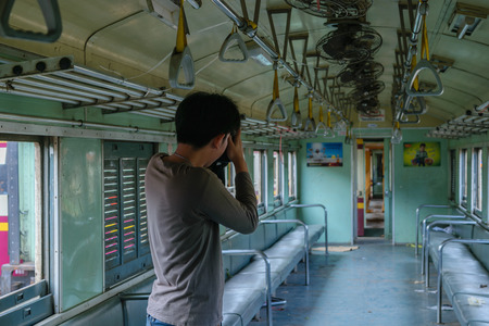 Bangkok, Thailand - September 5, 2015 : Unidentified photographer train shooting. Many people in Thailand popular travel by train because it is cheaper.のeditorial素材