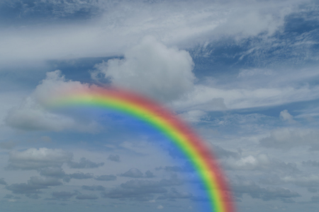 Nature cloudscape with blue sky and white cloud with rainbowの写真素材