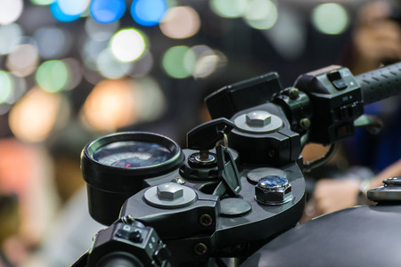 Zoom at Motorcycle handlebar in Car show event with light bokeh at Bangkok, Thailand. This a open event no need press credentials required.の写真素材