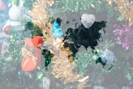 Christmas tree decoration for merry christmas Xmas and happy new year , process in vintage style with world mapの写真素材
