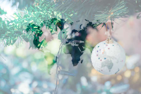 Christmas tree decoration for merry christmas Xmas and happy new year , process in vintage style with world mapの写真素材