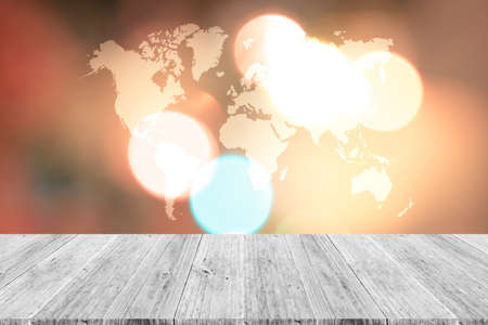 Wood terrace and Abstract bokeh background of Christmas tree decoration for merry christmas Xmas and happy new year , process in vintage style with world mapの写真素材