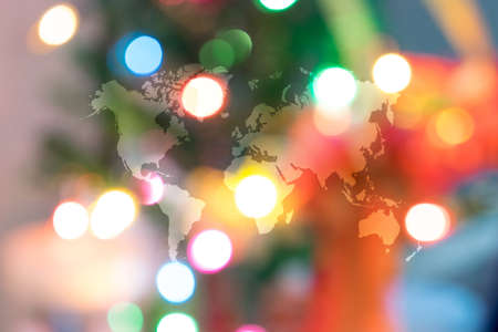 Abstract bokeh background of Christmas tree decoration for merry christmas Xmas and happy new year with world mapの写真素材