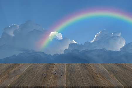 Wood terrace and Blue sky and white cloud with rainbowの写真素材