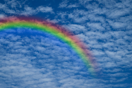 Nature cloudscape with blue sky and white cloud with rainbowの写真素材