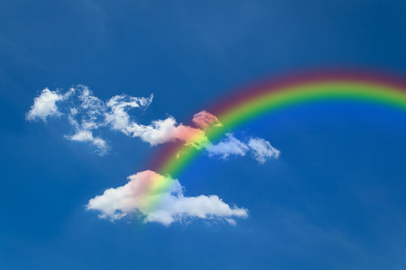 Nature cloudscape with blue sky and white cloud with rainbowの写真素材
