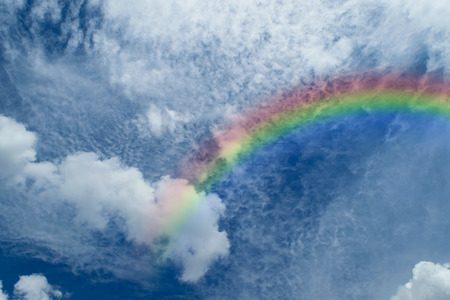 Nature cloudscape with blue sky and white cloud with rainbowの写真素材