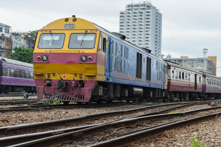 Bangkok, Thailand - September 5, 2015 : Unidentified railway train run on the railroad tracks. Many people in Thailand popular travel by train because it is cheaper.のeditorial素材