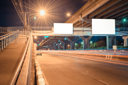 Night road long exposure with blank billboard for advertisement in Bangkok Thailandの写真素材