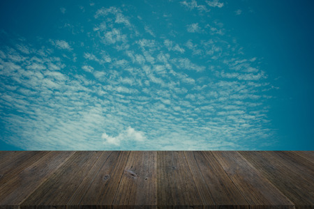 Nature cloudscape with blue sky and white cloud with Wood terrace , process in vintage styleの写真素材