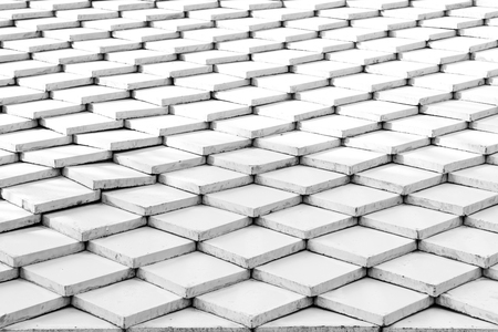 Tile roof of old Thai temple texture surface white color use for backgroundの写真素材