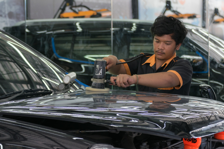 Bangkok, Thailand - December 12, 2015 : Unidentified car care staff cleaning the car (Car detailing).のeditorial素材