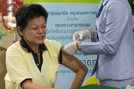 Bangkok, Thailand - December 4, 2015 : Unidentified Thai women get vaccinated against the flu every year by the Ministry of Health.のeditorial素材