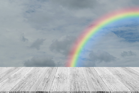 Nature cloudscape with blue sky and white cloud with Wood terrace and rainbowの写真素材