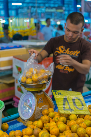 Bangkok, Thailand - January 28, 2016 : Thai street food with orange in market.のeditorial素材