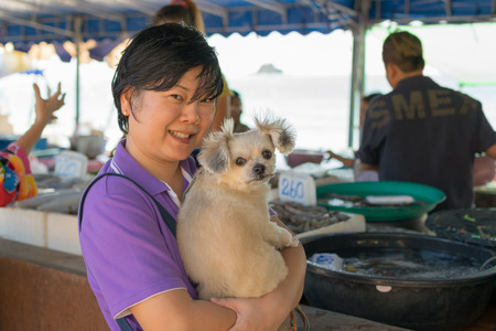 Rayong, Thailand - December 31, 2015 : Unidentified Thai woman and her pet shopping Thai seafood market at Laem Mae Phim Beach on Kram, Klaeng, Rayong, Thailand.のeditorial素材
