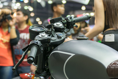 Zoom at motorcycle oil tank and handlebar in Car show event at Bangkok, Thailand. This a open event...