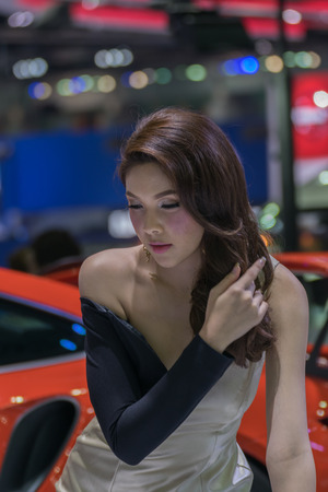 Bangkok, Thailand - December 10, 2015 : Unidentified model pretty lady on display in car show event. This a open event no need press credentials required.のeditorial素材