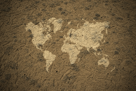Sand texture surface natural color use for background , process in vintage style with world mapの写真素材
