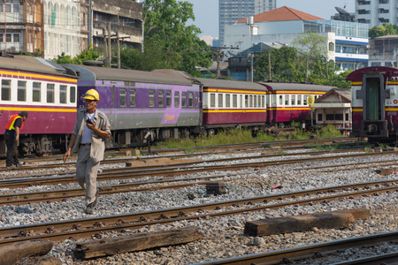 Bangkok, Thailand - April 12, 2016 : Unidentified railway employees controlling the locomotive for switching the railway before serving at State Railway of Thailand.のeditorial素材