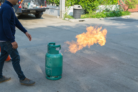 Bangkok, Thailand - January 31, 2016 : Many people preparedness for fire drill and training to use a fire safety tank in village at Bangkok Thailand.のeditorial素材