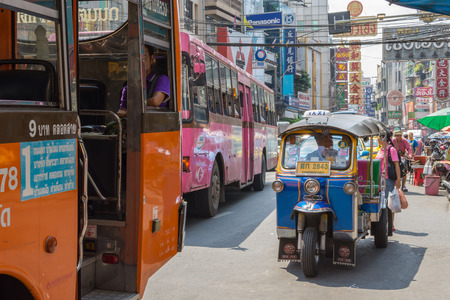 Bangkok, Thailand - May 3, 2016 : Thai TukTuk taxi and bus service on the road in chinatown Bangkok, Thailand.のeditorial素材