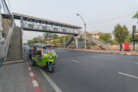 Bangkok, Thailand - March 19, 2016 : Thai TukTuk taxi parking in the row on the road in Bangkok, Thailand.のeditorial素材